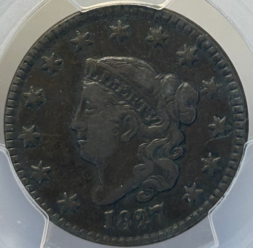 Coin in a protective case with 'Every Day Coin' and 'PCGS' branding on a red background