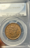 Gold coin in a clear holder with 'PCGS MS64BN' label against a blue background