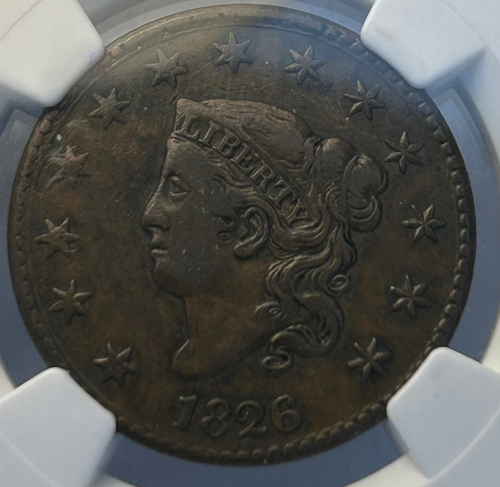 Ancient coin with 'Liberty' head design in a protective holder with NGC label.